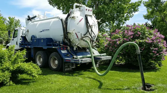 Professional vacuum truck performing residential drainage and septic maintenance in Portland, OR